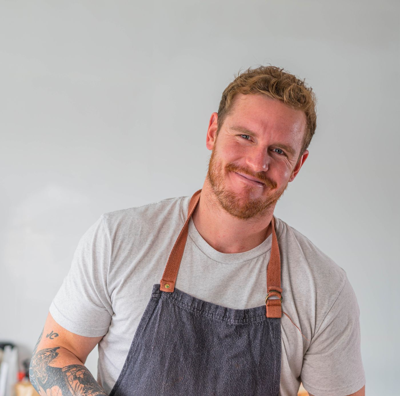 Andrew smiling in his chef's apron